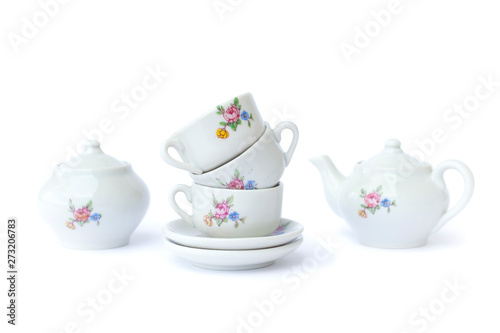 Foto Vintage toy tea-set on white background