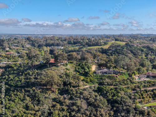 Aerial view of wealthy countryside area with luxury villas with swimming pool, surrounded by forest and mountain valley. Ranch Santa Fe. San Diego, California, USA.