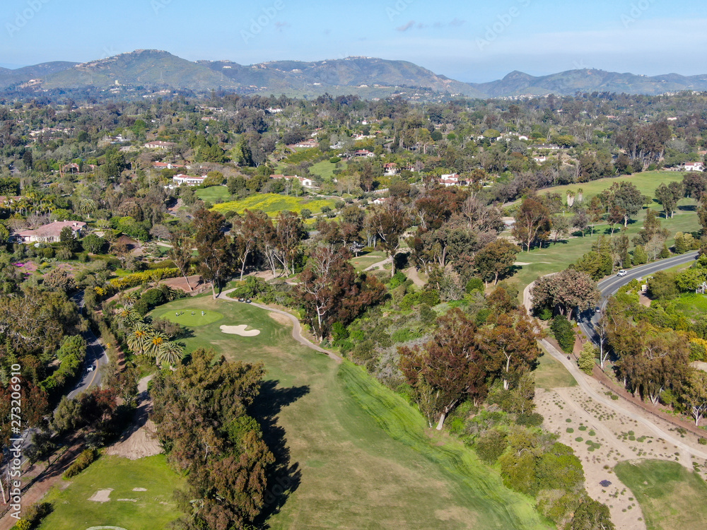 Aerial view of a beautiful wealthy green golf course next the valley. San Diego, California. USA. 