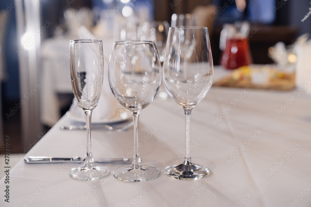 empty glasses for different drinks on the table empty glasses for different drinks on the table