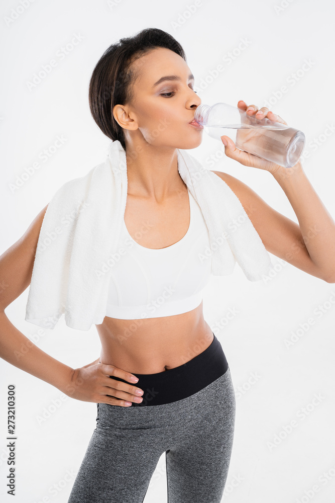 Fitness female drinking clean water after exercise Fitness female drinking clean water after exercise