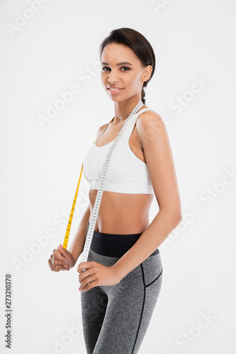 Fitness female with tape measure after exercise © Yakobchuk Olena