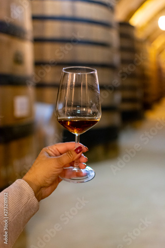 Bilde på lerret Tasting of fortified dry or sweet marsala wine in vintage wine cellar with old o