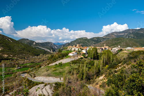 Valley of Veral river in Spanish Pyrenees in Aragon region.  Binies village with the castle and San Salvador church is at right photo