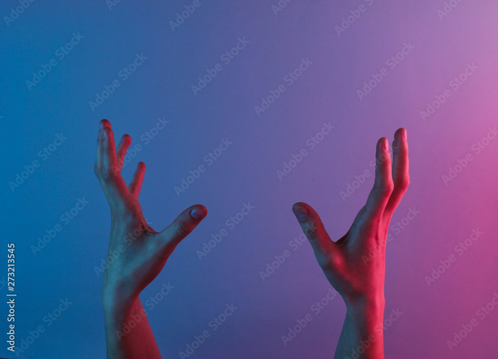 Awesome female hands with blue neon red light. Halloween theme. Minimalism fashion. Surrealism. Concept art