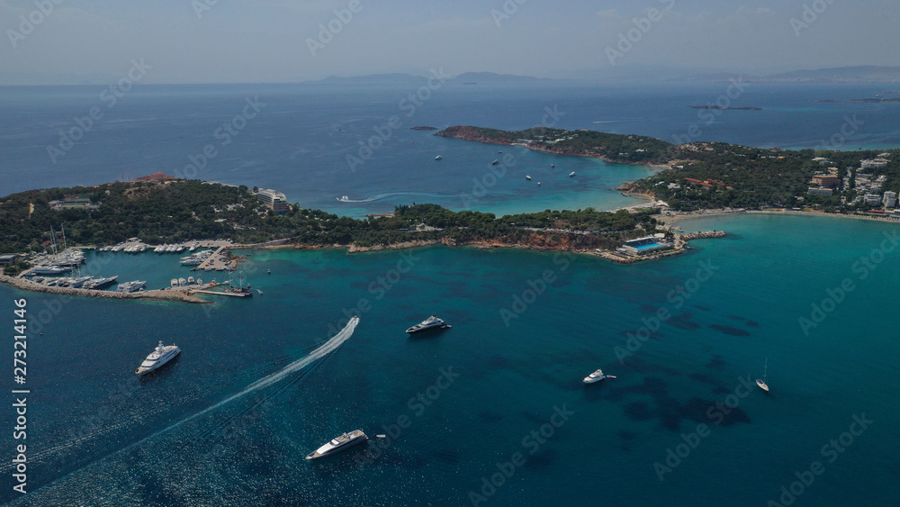 Aerial view of iconic emerald sandy celebrity beach of Asteras or Astir, Vouliagmeni, Athens riviera, Attica, Greece