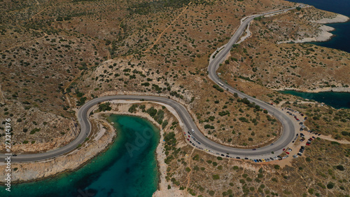 Aerial view photo of road in Athens riviera seaside known limanakia forming small bays with turquoise clear sea, Vouliagmeni, Attica, Greece © aerial-drone