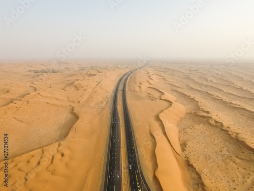 Aerial view of misty roads in the desert of Umm Al Quwain, United Arab Emirates. photo