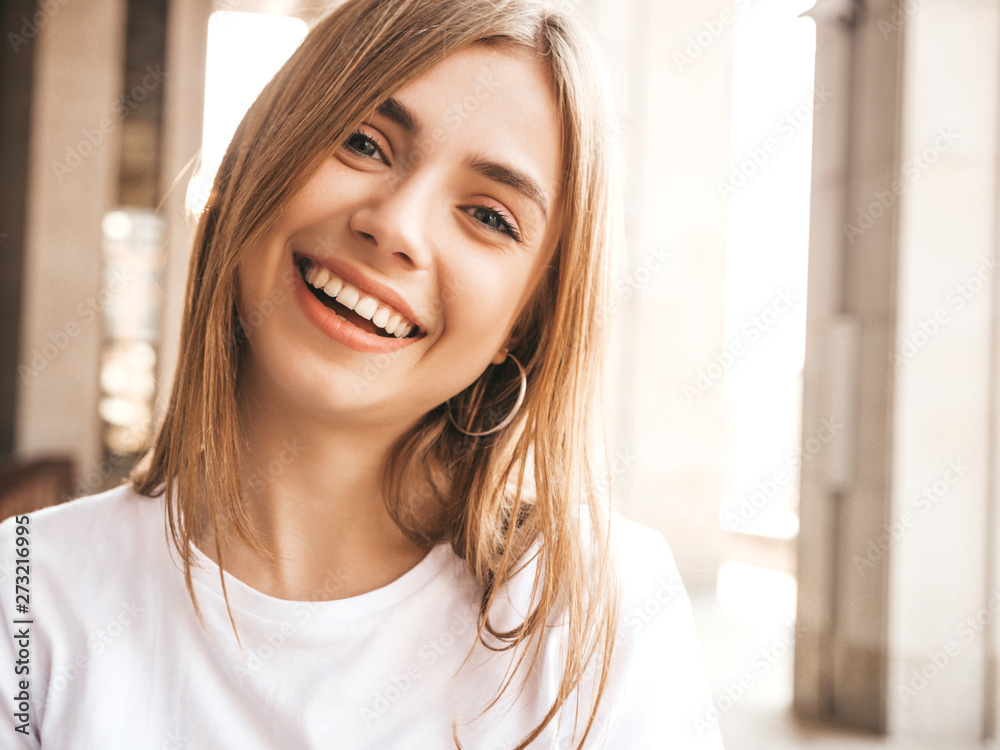 Portrait of beautiful smiling blond model dressed in summer hipster clothes. Trendy girl posing in the street background. Funny and positive woman having fun - obrazy, fototapety, plakaty 