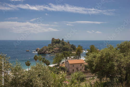 Taormina Sicily scenic view of Isola Bella from the hill, green nature, railway and beautiful seascape