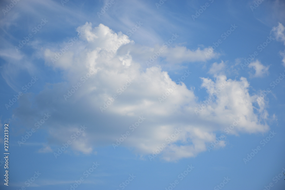 White cloud with blue sky behind