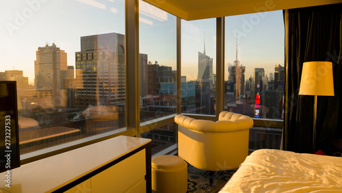 CLOSE UP: Spectacular view of downtown New York at sunrise from a hotel room.