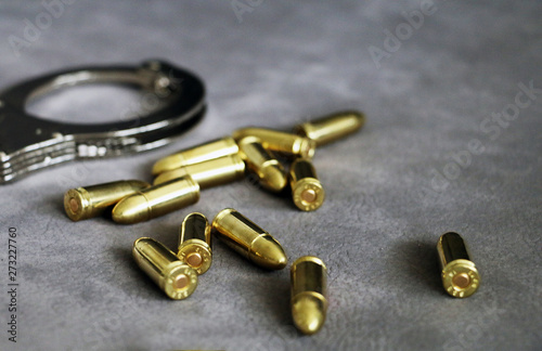 Pistol bullets and handcuffs