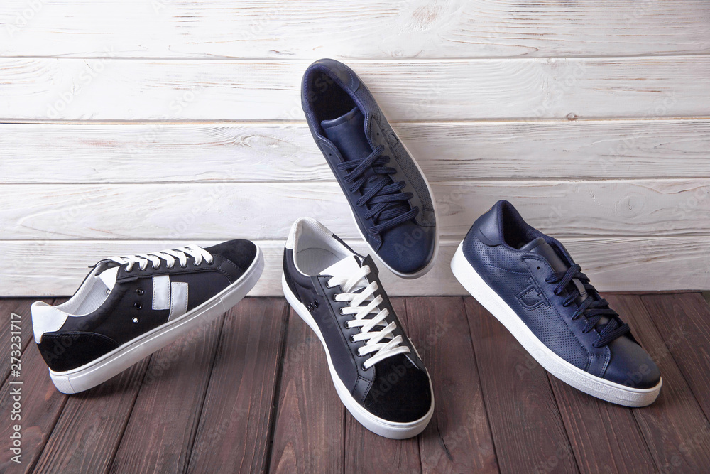 two pairs of black and blue leather shoes two pairs of black and blue leather shoes