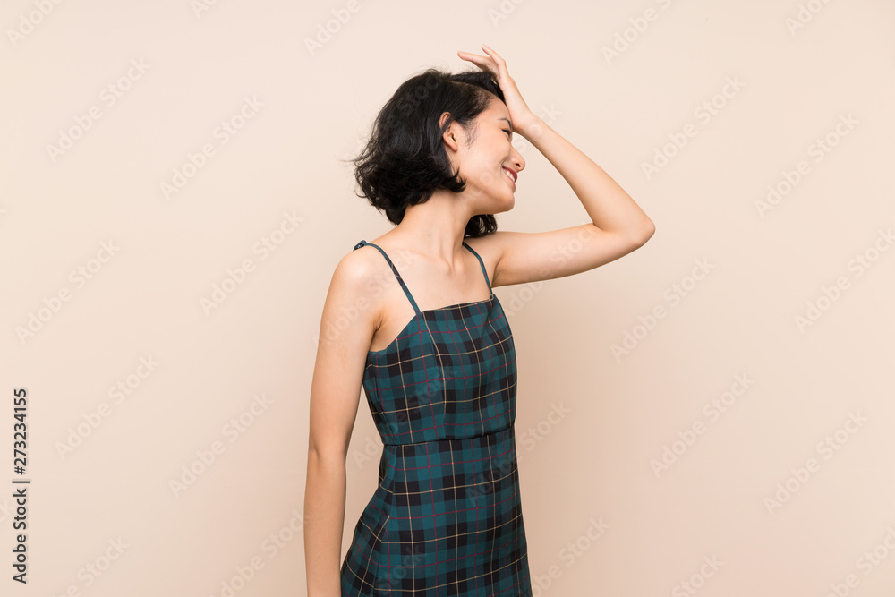 Asian young woman over isolated yellow wall has realized something and intending the solution Asian young woman over isolated yellow wall has realized something and intending the solution