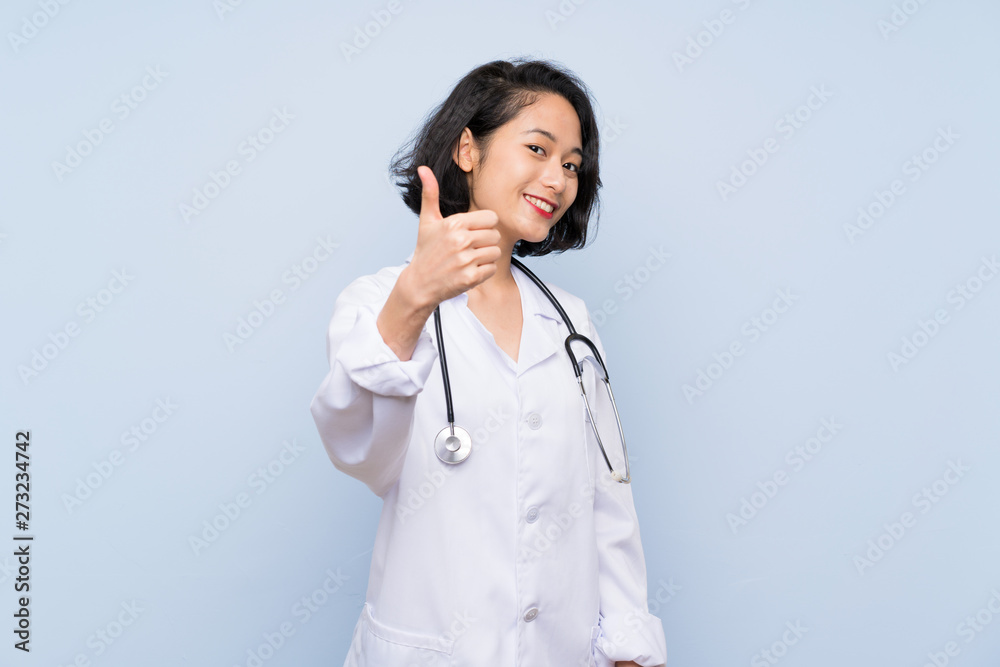 Doctor Asian woman with thumbs up because something good has happened Doctor Asian woman with thumbs up because something good has happened