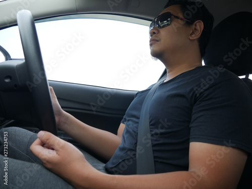 Young Asian Man Driving a Car © airdone