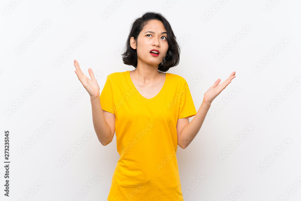 Asian young woman over isolated white background frustrated by a bad situation Asian young woman over isolated white background frustrated by a bad situation