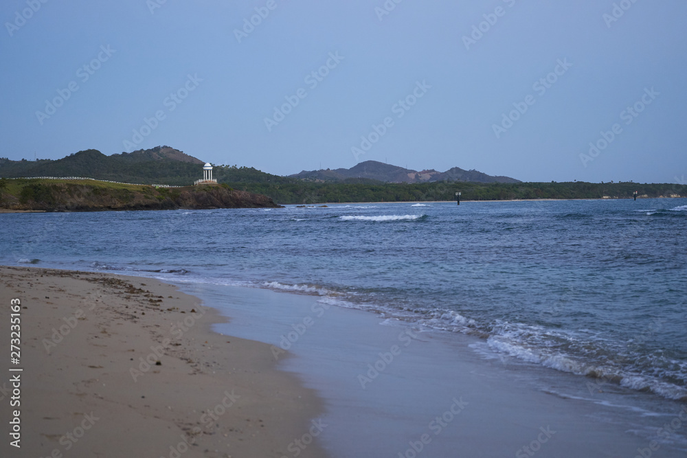 Sunrise over a tropical island with a sandy beach. Sunrise over a tropical island with a sandy beach.