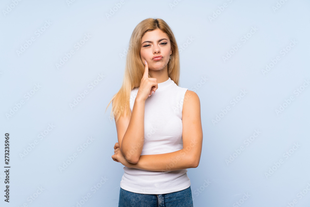Teenager girl over isolated blue background counting ten with fingers Teenager girl over isolated blue background counting ten with fingers