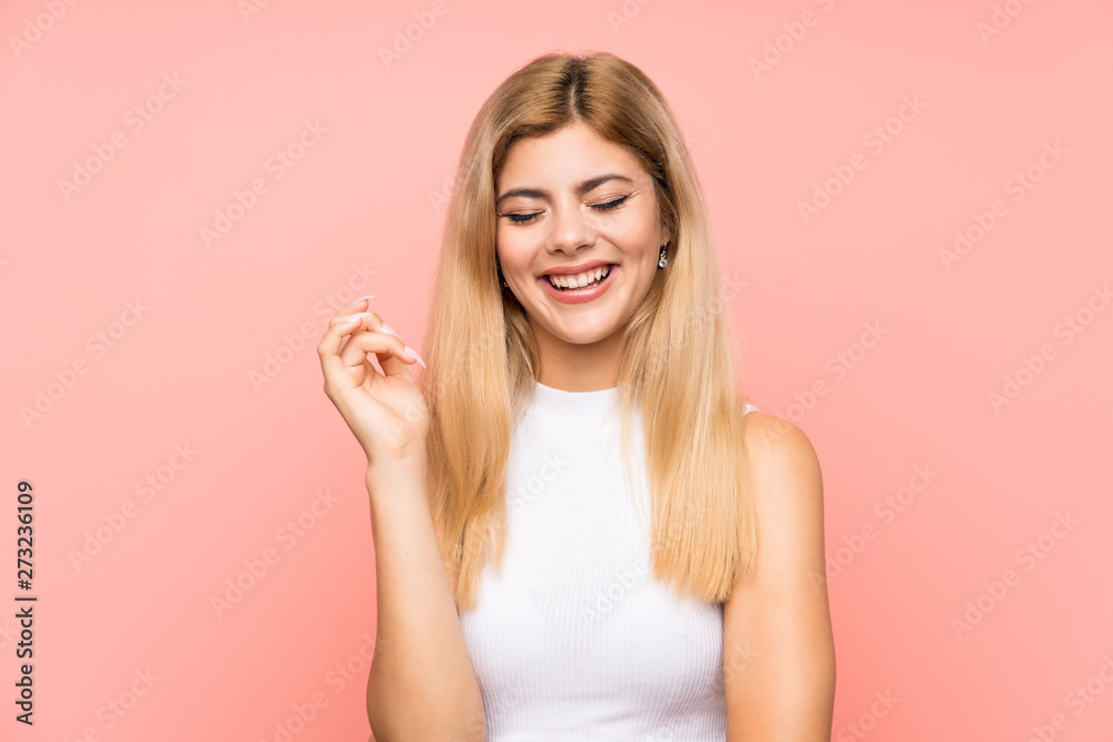 Teenager girl over isolated pink background laughing Teenager girl over isolated pink background laughing