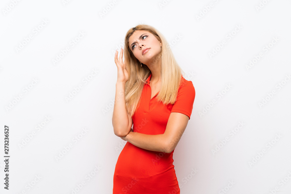 Teenager girl over isolated white background having doubts Teenager girl over isolated white background having doubts