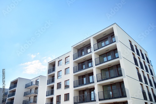 Multistory new modern apartment building. Stylish living block of flats.