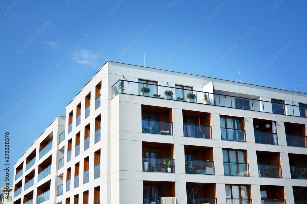 Multistory new modern apartment building. Stylish living block of flats.