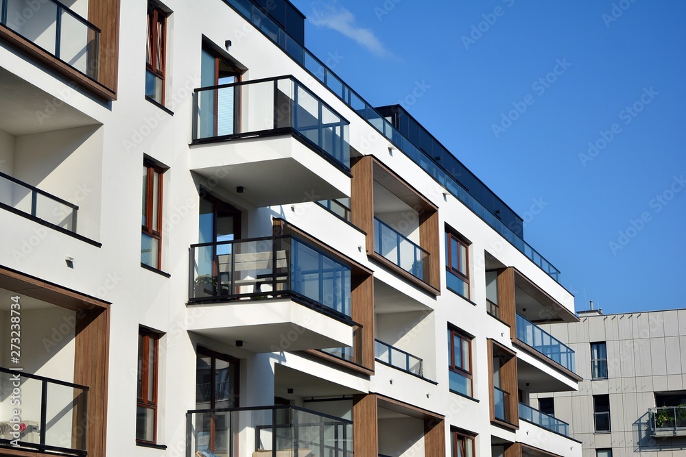Multistory new modern apartment building. Stylish living block of flats. Multistory new modern apartment building. Stylish living block of flats.