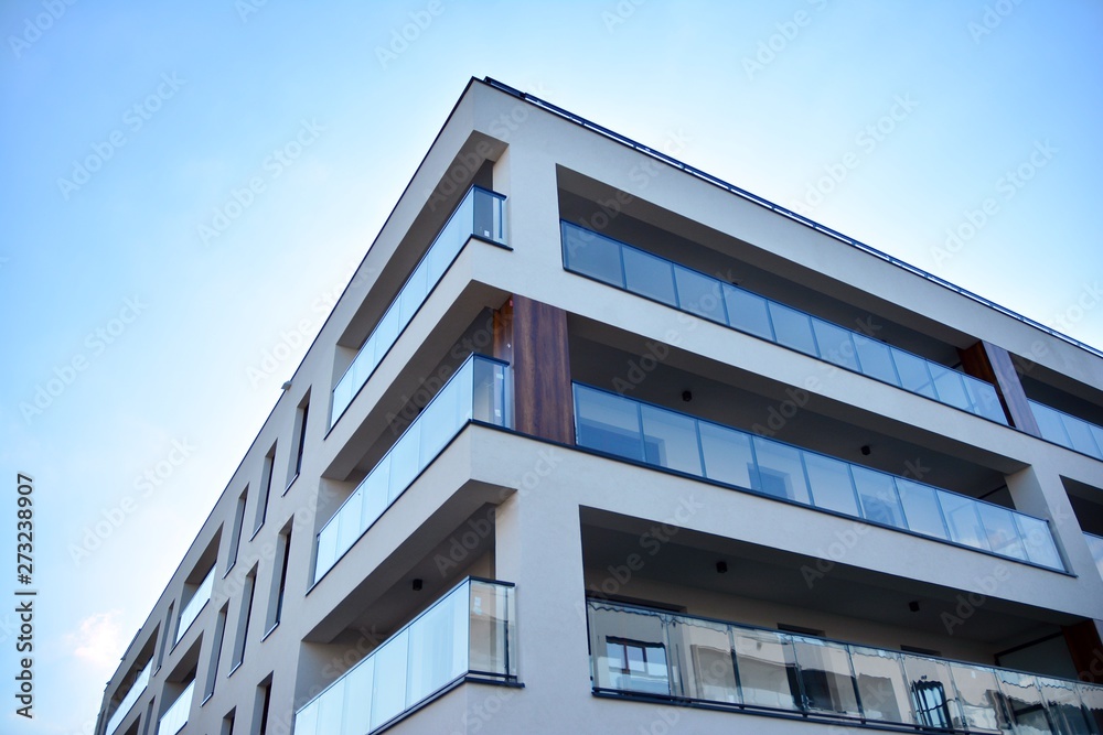 Multistory new modern apartment building. Stylish living block of flats.