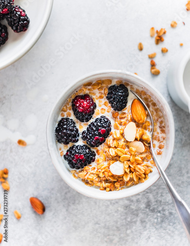 Healthy granola bowl with blackberries and almonds photo