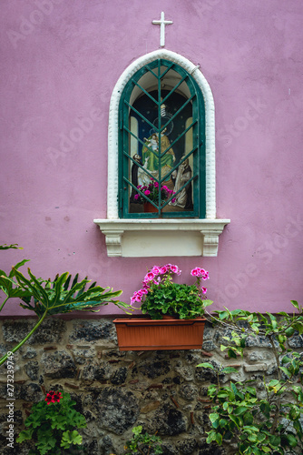 Shrine on the building wall in Aci Castello town on Sicily Island, Italy