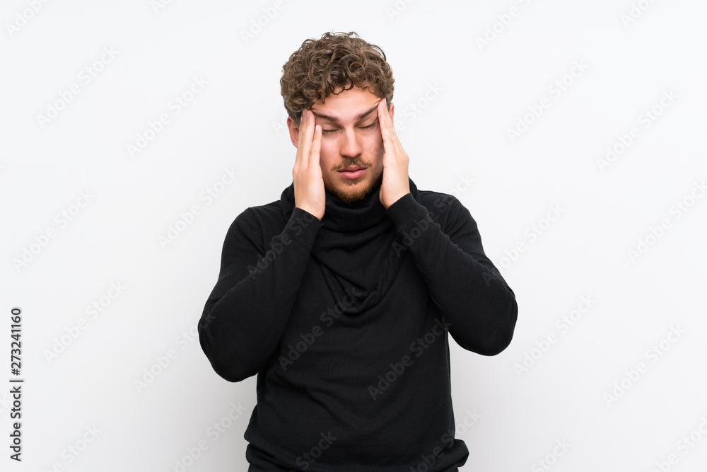 Blonde man over isolated white wall with headache Blonde man over isolated white wall with headache