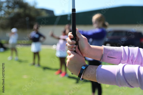 Fotografija girls group golfing instruction