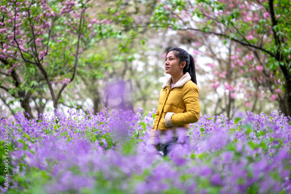 Unspecific woman looking at the Cherry blossom in the east lake. Unspecific woman looking at the Cherry blossom in the east lake.