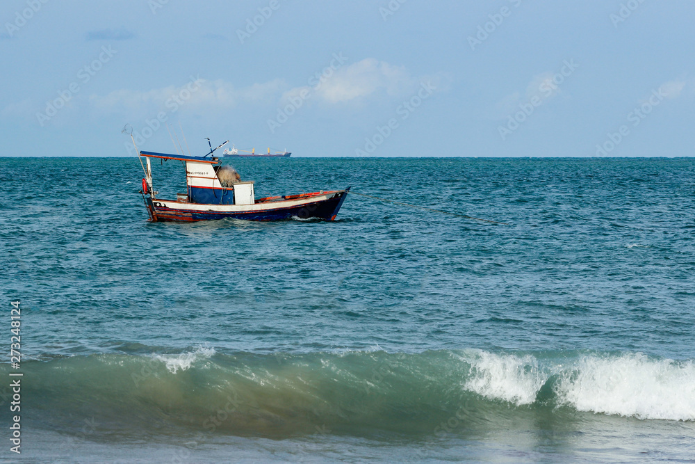 Fisherman's boat. Sailing the wind through the waves at sea.