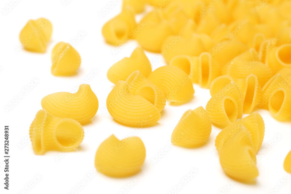 Italian pasta (Gomiti Rigati) on white background Italian pasta (Gomiti Rigati) on white background