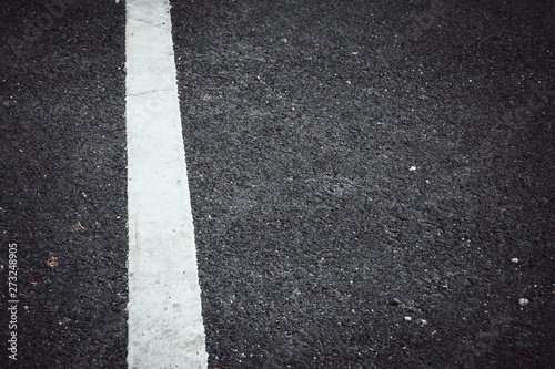 asphalt road texture with white line, copy space © iamtui7