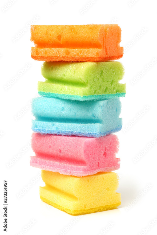 Brightly colored sponges on white background with copy space Brightly colored sponges on white background with copy space