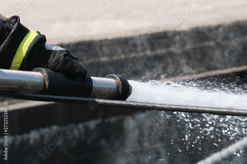 Fireman spraying water.