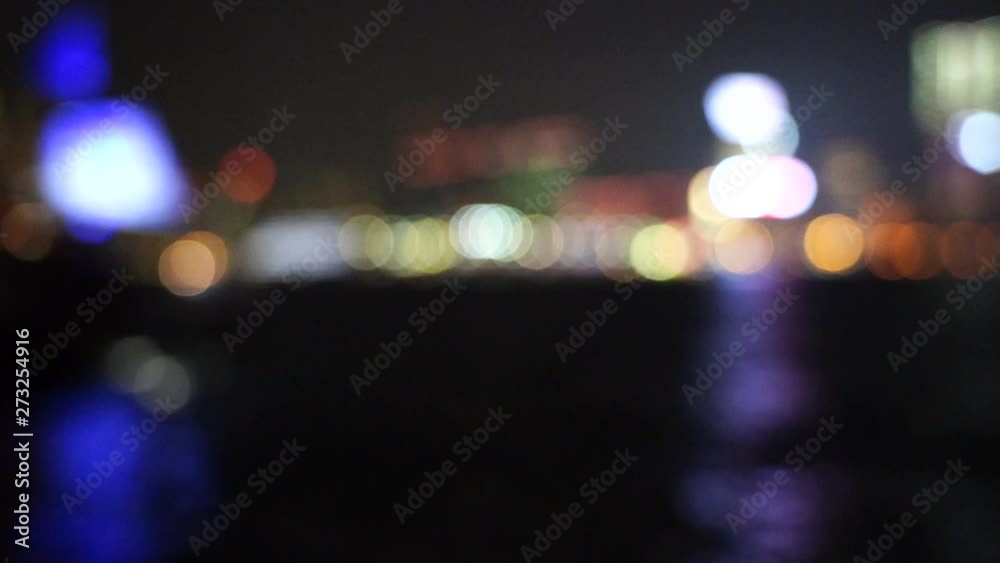Hong Kong Victoria harbor in bokeh at night; Slow motion Hong Kong Victoria harbor in bokeh at night; Slow motion