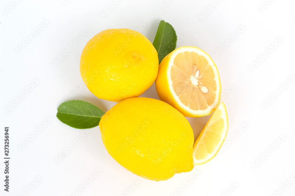 fresh lemon with lime and leaves on white background