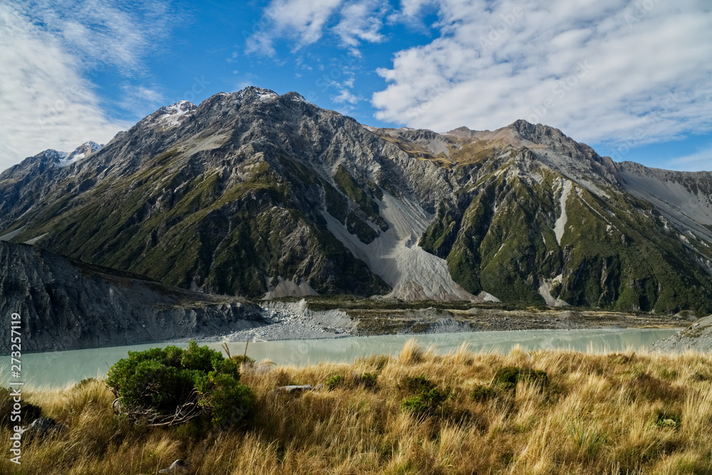Mountain behind a valley and a creek on the southern island of new zealand