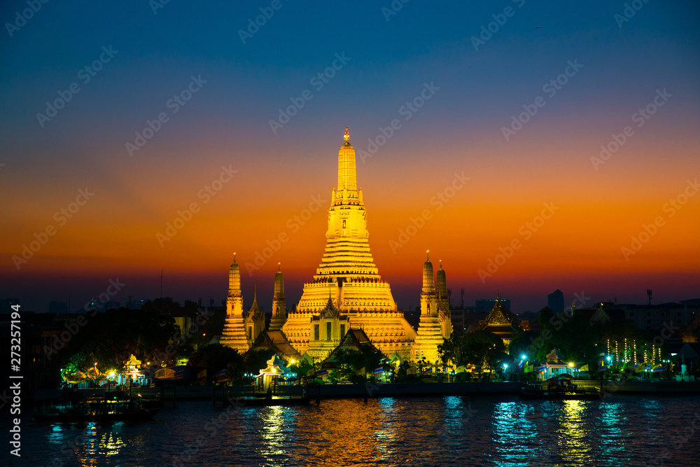 Sunset at Arun Temple or Wat Arun, locate at along the Chao Phraya river with a colorful sky in Bangkok, Thailand