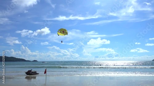 Parasailing in Patong beach, Thailand, famous beach that full of tourist from around the world.