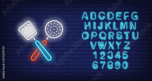 Crossed slotted spoon and turner neon sign. Cooking and kitchen utensils design. Night bright neon sign, colorful billboard, light banner. Vector illustration in neon style.