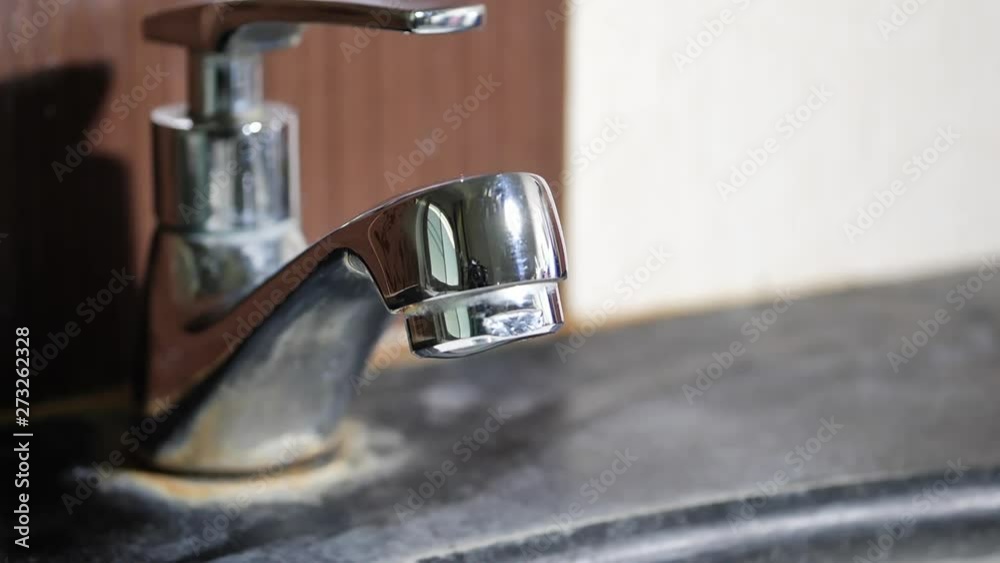 slow motion water drop leaking in close faucet slow motion water drop leaking in close faucet