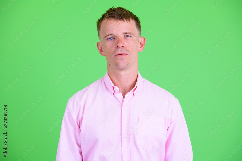 Face of businessman with pink shirt looking at camera Face of businessman with pink shirt looking at camera
