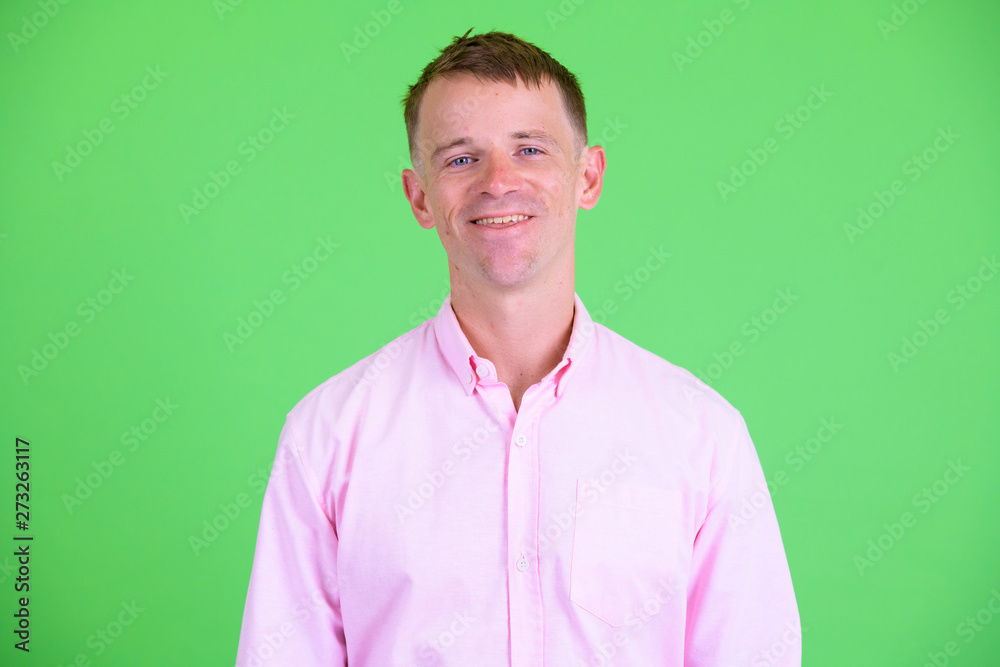 Face of happy businessman with pink shirt smiling Face of happy businessman with pink shirt smiling