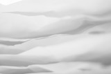 Closeup of white paper layers stack abstract art background. Defocused fog effect. Copy space.